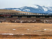 A train hauls oil into Glacier National Park near the Badger-Two Medicine National Forest in northwest Montana.  U.S. officials said they&#039;ve canceled 15 oil and gas leases in an area bordering Glacier National Park that&#039;s considered sacred to the Blackfoot tribes of the U.S. and Canada. Interior Secretary Sally Jewell said the Wednesday, Nov. 16, 2016, move will preserve the 130,000-acre Badger-Two Medicine area within the Lewis and Clark National Forest. The Badger-Two Medicine is the site of the creation story for members of Montana&#039;s Blackfeet Nation and the Blackfoot tribes of Canada.