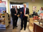 New York mayor Rudy Giuliani, left, and then-Republican presidential candidate Donald Trump buy cookies in October at an Eat&#039;n Park in Moon Township, Pa. Trump prefers fast-food restaurants, feeling their food is safer.