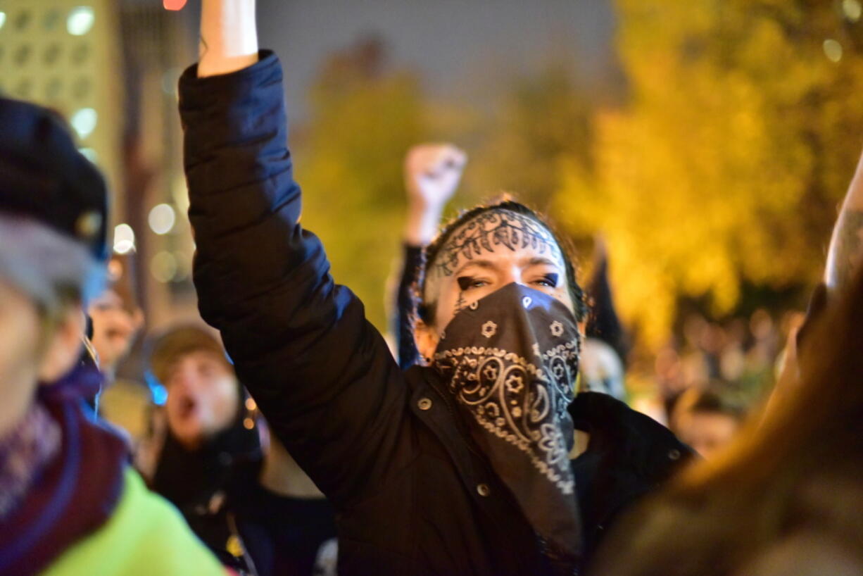 People gather at Portland City Hall for an anti-Trump protest Friday night in Portland.