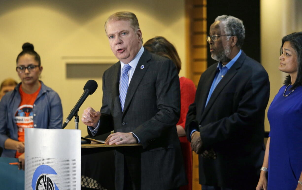 Seattle Mayor Ed Murray, second left, speaks at a post-election event of elected officials and community leaders at City Hall in Seattle. Leaders in Seattle, San Francisco and other so-called &quot;sanctuary cities&quot; say they won&#039;t change their stance on immigration despite President-elect Donald Trump&#039;s vows to withhold potentially millions of dollars in taxpayer money if they don&#039;t cooperate.