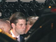 President-elect Donald Trump, right, kisses son Eric farewell after dining at the 21 Club on Tuesday in New York.