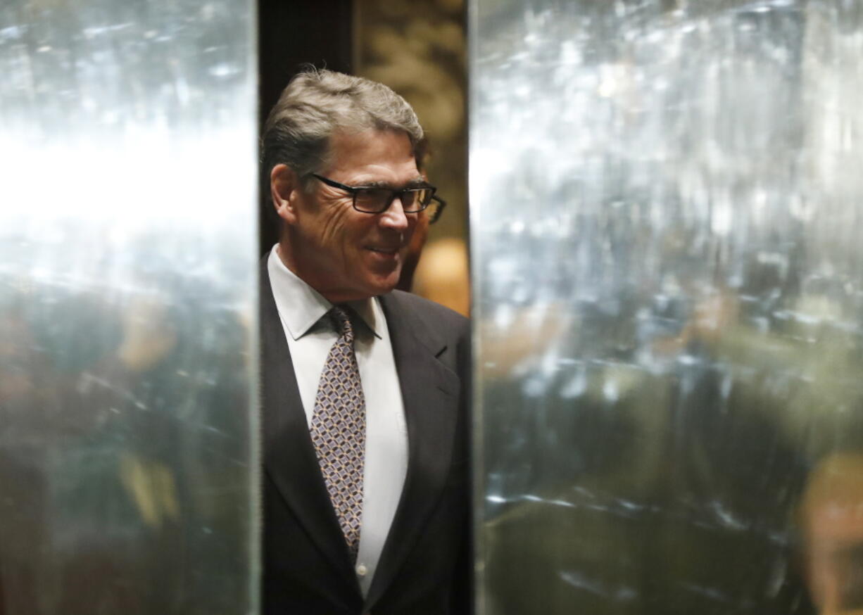 An elevator door closes as former Texas Gov. Rick Perry arrives at Trump Tower on Monday in New York.