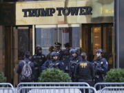 Security personnel stand at the front entrance of Trump Tower in New York on Thursday.