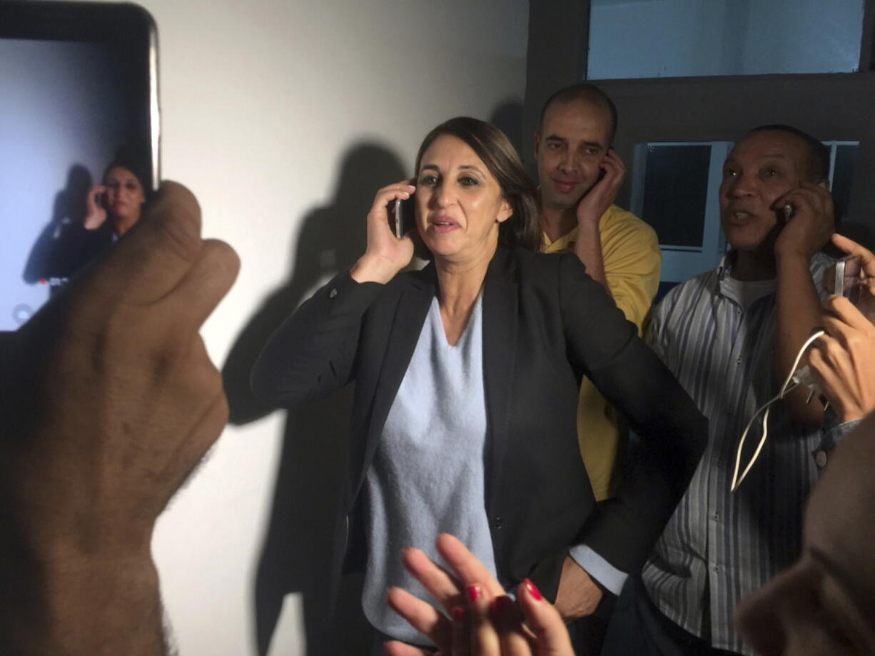 Nabila Mounib, Secretary General of the Federation of the Democratic Left, takes a call at her headquarters in Casablanca, Morocco,, as preliminary results on election night show her party has won 2 seats in parliament.