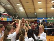 Woodland volleyball coach Jeff Nesbitt gathers with his players after the Class 2A state championship match won by Tumwater on Saturday at St. Martin's University in Lacey.