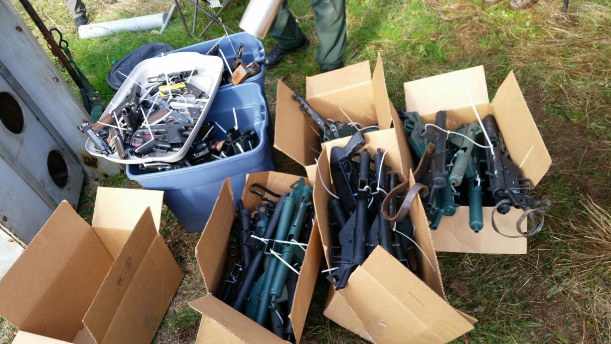 More than 400 guns were seized Wednesday after the Cowlitz County Sheriff's Office investigated a report of stolen firearms. Eight people were arrested in the theft case, but charges are also being considered for the victim, whom the agency said is not allowed to legally own firearms.