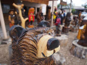 A carved bear greats visitors to Grizzlie&#039;s Workshop in downtown Ruidoso, N.M.