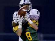 Richland High School's Alex Chapman (8) intercepts a pass to Skyview High School's Jeremiah Wright (21) Saturday during a 4A semifinal game at Neil F. Lampson Stadium in Kenenwick.