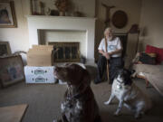 Orchards resident John Schumacher is pictured Wednesday at his home with his 10-year-old dogs Max, left, and Faith. Schumacher is preparing to move into an assisted living center and must find a new home for his dogs. A Salmon Creek man is interested in adopting the dogs.