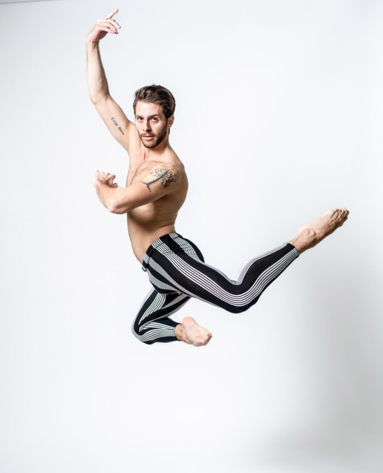 Corey Landolt, a dancer from the Washington Ballet shows off his tattoos.