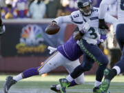 Vikings defensive end Everson Griffen (97) tackles as Seahawks quarterback Russell Wilson (3) during last season&#039;s wild-card playoff game in Minnesota. (Nam Y.