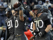 Army running back Andy Davidson (40) celebrates his touchdown with teammates in the first half of the Army-Navy NCAA college football game in Baltimore, Saturday, Dec. 10, 2016.