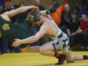 Union's Tommy Strassenberg heaves West Linn's Sean Harman during the Pac-Coast wrestling tournament at Mountain View High School on Friday, December 30, 2016. Harman beat Strassenberg to win the 160-pound weight class.