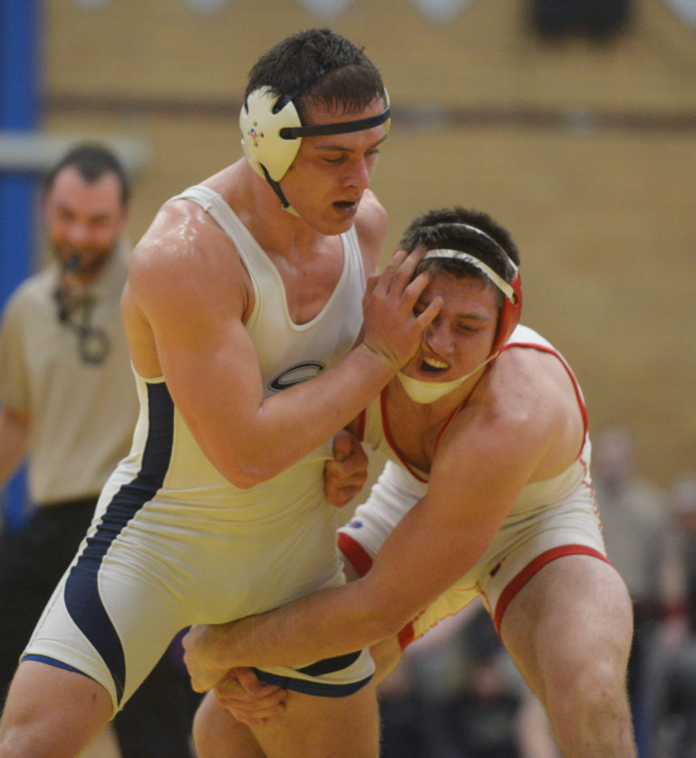 Skyview's Jackson McKinney pushes Camas' Samuel Malychewski away during the Pac-Coast wrestling tournament at Mountain View High School on Friday, December 30, 2016. McKinney beat Malychewski to win the 182-pound weight class.