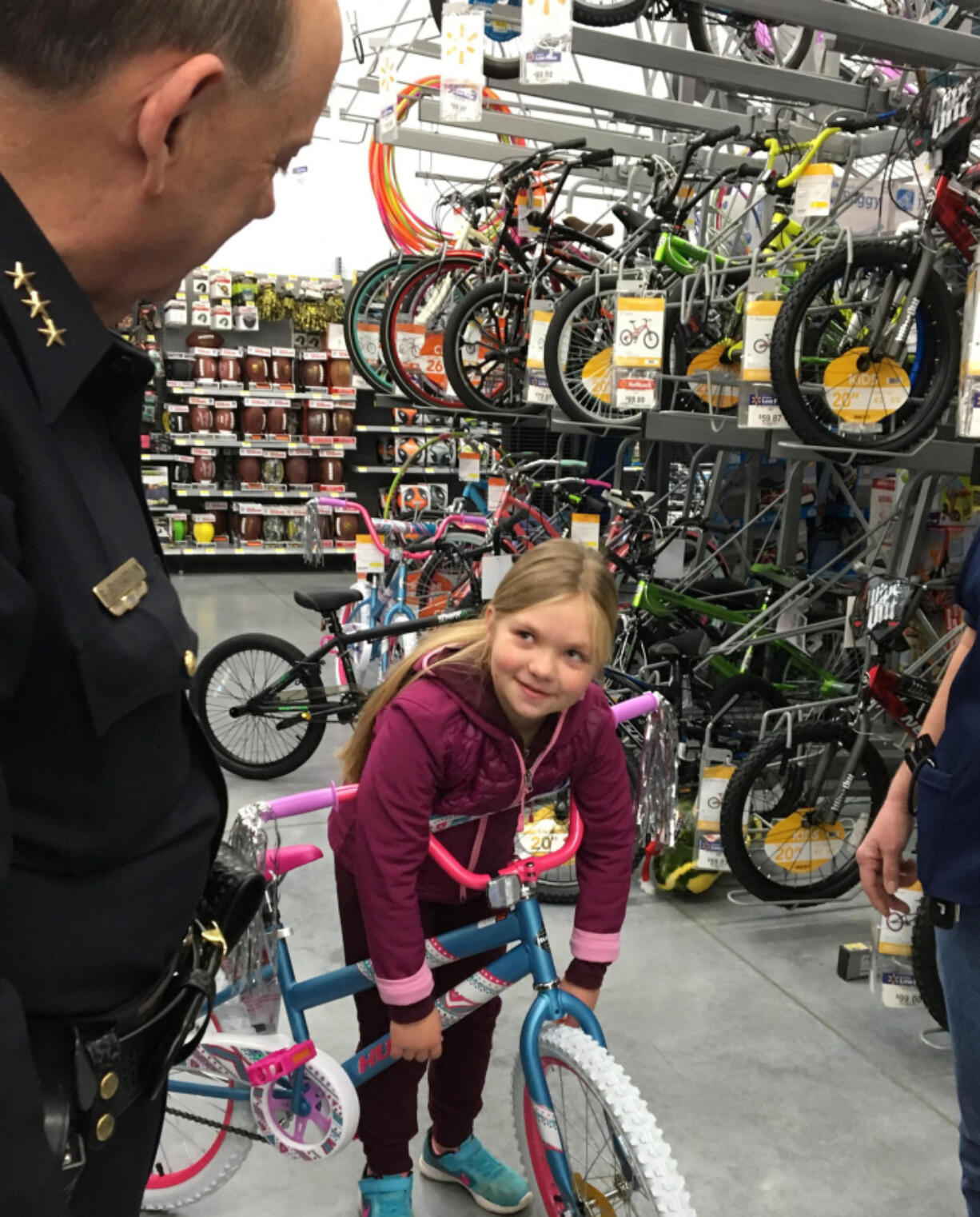 Battle Ground: Battle Ground Police Chief Bob Richardson shops with a student Dec.