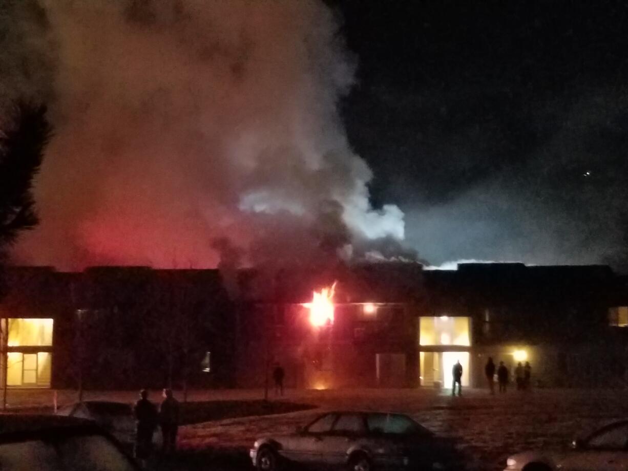 Fire burns in a second-story unit Friday at the Parklane Apartments in Hazel Dell (Photo by Rick Anderson)