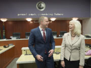 Incoming Clark County council members John Blom, left, and Eileen Quiring share a laugh following their swearing-in ceremony at the Clark County Public Service Center on Thursday morning.