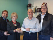 Portland: Dale Vrsalovich, from left, Art Liss and Ray Zimmerman from the Afifi Shriners Vancouver Gateway Shrine Club present a $2,500 check to Kathy Park, director of Donor Development for the Portland Shriners Children&#039;s Hospital.