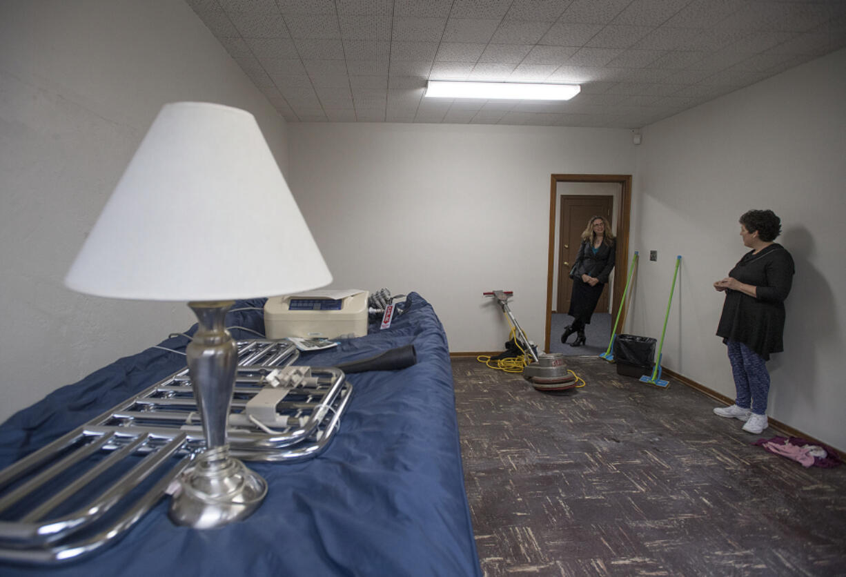 Share Deputy Director Amy Reynolds, left, talks with parishioner Deb Stavig in one of the four rooms under renovation for the Women&#039;s Housing and Transition, or WHAT, shelter at St. Luke&#039;s Episcopal Church.