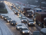 Drivers traveling on Interstate 5 navigate winter conditions as they make their way toward Portland on Wednesday afternoon.