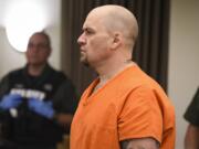 Shannon Stover, who is accused of impersonating a police officer as a ruse to kidnap and rape a woman, appeared in Clark County Superior Court on Monday.