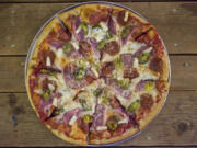 The Armageddon pizza is served Dec. 16 at Doomsday Brewing Co. in Washougal. It is topped with pepperoni, Canadian bacon, pineapple and jalapenos.