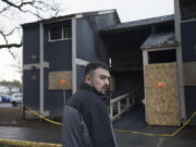 Rex Donaldson of Vancouver stands Monday at the scene of an apartment fire that occurred over the weekend at the Fort Vancouver Terrace Apartments.