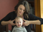 Chiropractor Cecelia Mikles checks 13-month-old Briar Freitas&#039; cranium bones during an appointment Nov. 28. Mikles discovered Briar&#039;s cranium bones were shifting and uneven.