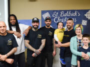 North Garrison Heights: Barbers from King&#039;s Barber Shop, from left, Juan Naranjo, Ryan Alexander, Ryan Wieser, and Mustafa Aljaf, with the Loomis family, from left, Halsten, Mike, Monica and Rennick Loomis. The barbers cut hair at a St.