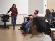 Strategic U leader Melanie Shelton, from left, works with juniors Wadi Yakhour and Kelsie Reef and sophomore Kyle Yenne during the club&#039;s Monday afternoon meeting at Washington State University Vancouver. The club has been helping local nonprofits improve their messaging.