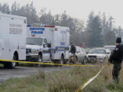 Police vehicles and crime tape surround the scene of an officer-involved homicide Sunday near a rural home east of Ridgefield. The deputy who shot and killed a suspected prowler on the property Sunday morning has been placed on leave during the shooting investigation, according to the Clark County Sheriff&#039;s Office.
