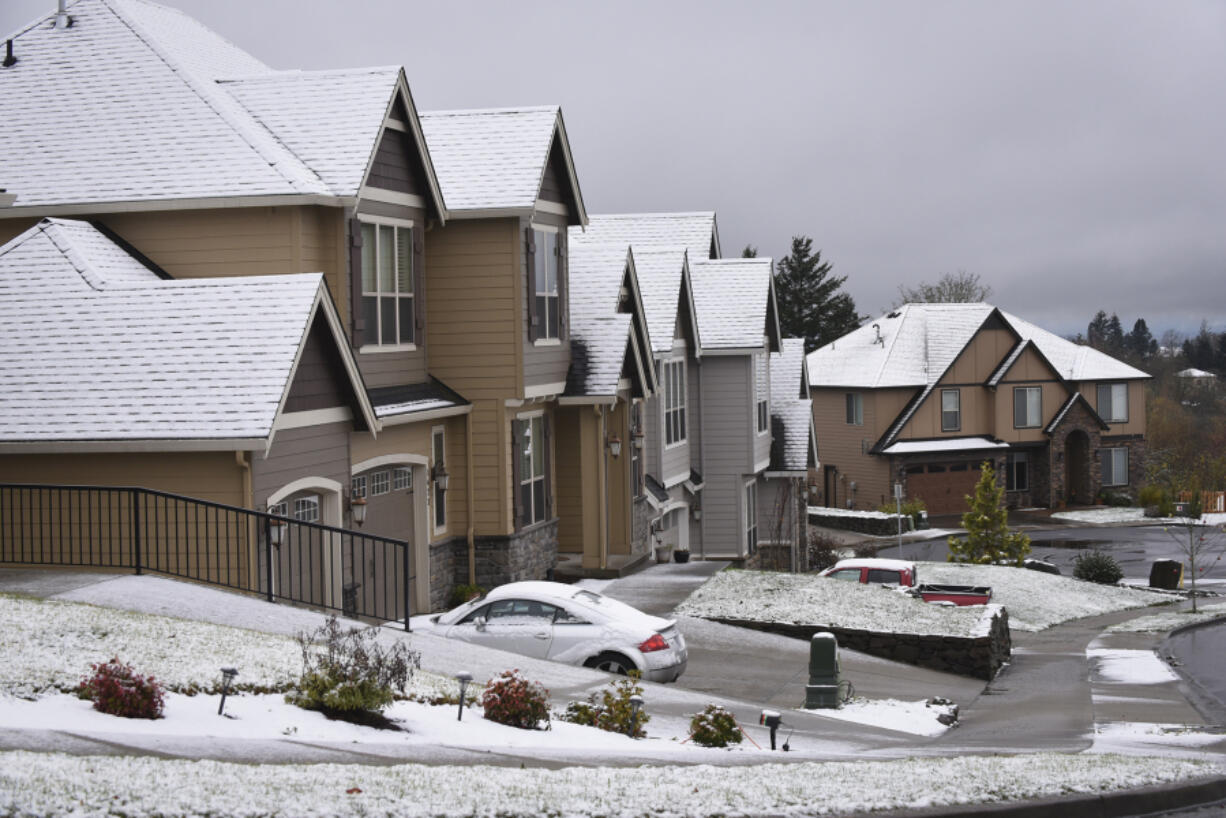 Snow coats the rooftops of homes on Prune Hill in Camas Monday.