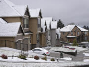 Snow coats the rooftops of homes on Prune Hill in Camas Monday.