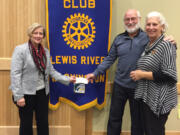 Battle Ground: North County Food Bank&#039;s Jill Kurtz, from left, and John Idsinga accept a check for more than $8,000 from Lewis River Rotary President Kathleen Hensch-Fleming.