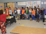 Washougal: Gause Elementary School fourth- and fifth-graders take their oath to serve as new members of the School Safety Patrol, where they will help fellow students navigate the crosswalk near the school.