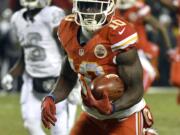 Kansas City Chiefs wide receiver Tyreek Hill (10) runs for a touchdown on a 78-yard kickoff return during the first half of an NFL football game against the Oakland Raiders in Kansas City, Mo., Thursday, Dec. 8, 2016.