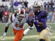 Washington's John Ross, right, is the player of the year on the Associated Press All-Pac-12 team announced on Friday, Dec. 9, 2016.