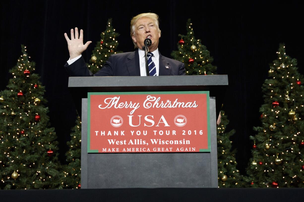 FILE - In this Dec. 13, 2016, file photo, President-elect Donald Trump speaks during a rally at the Wisconsin State Fair Exposition Center in West Allis, Wis. Trump is embracing some of his top attacks on Hillary Clinton as he forms his new administration, engaging in some of the same behavior he used against his rival during the presidential campaign.