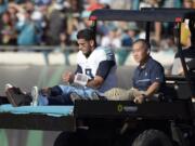 Tennessee Titans quarterback Marcus Mariota leaves the field on a cart after he was injured during the second half of an NFL football game against the Jacksonville Jaguars, Saturday, Dec. 24, 2016, in Jacksonville, Fla. (AP Photo/Phelan M.