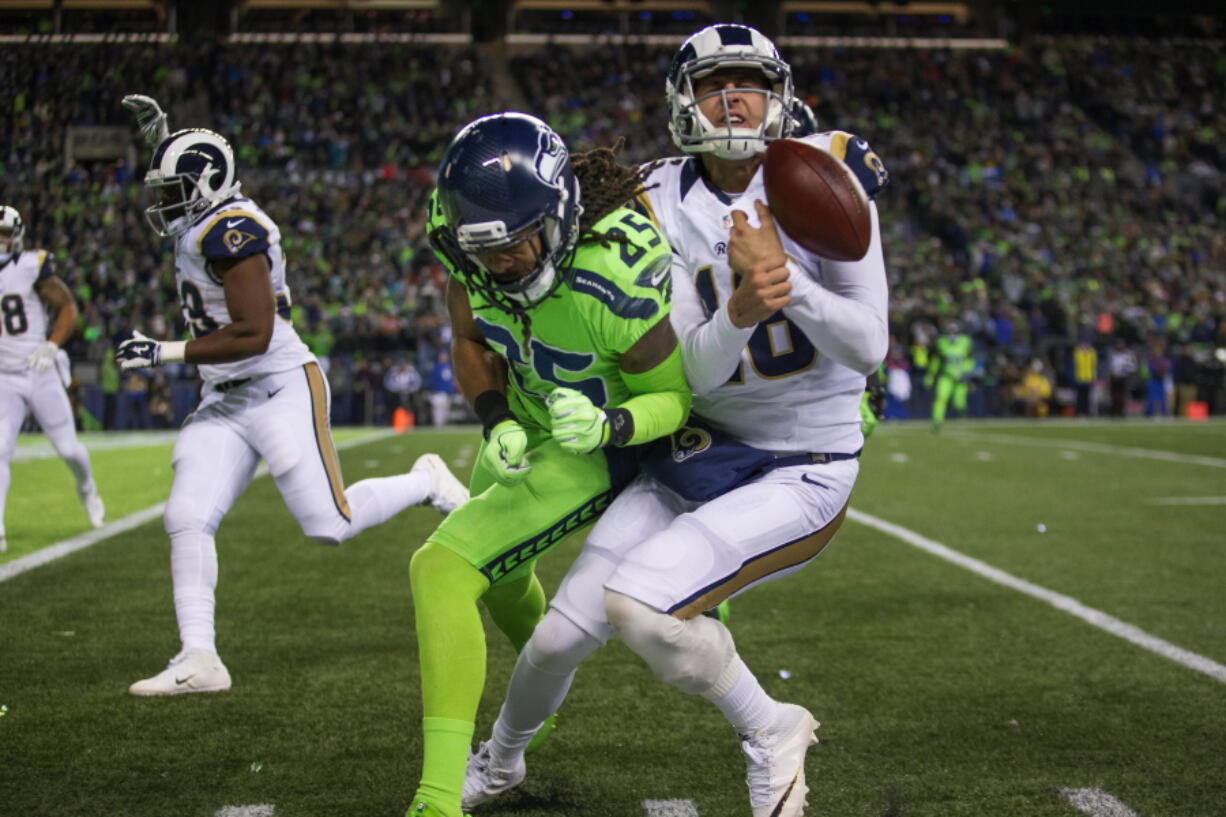 Seahawks&#039; cornerback Richard Sherman lays a big hit on Rams quarterback Jared Goff knocking him out of bounds.