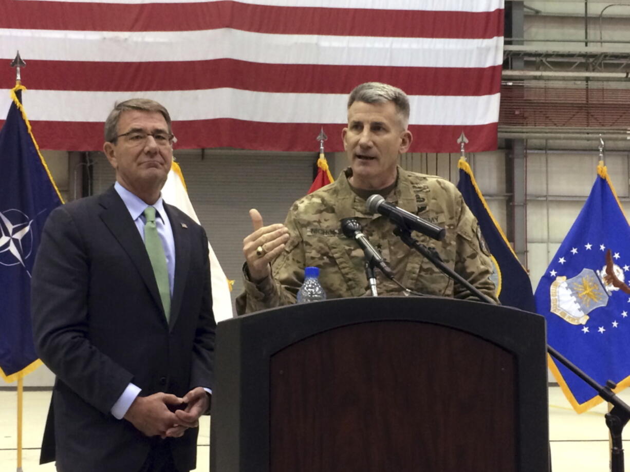 Army Gen. John Nicholson, right, speaks at a news conference Friday with U.S. Defense Secretary Ash Carter at Bagram Air Base, north of Kabul, Afghanistan.