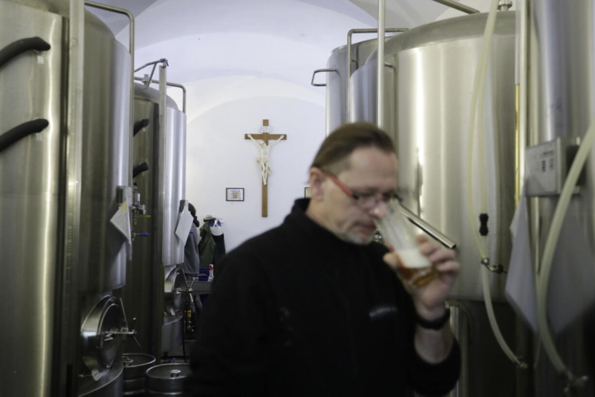 Master brewer Jiri Kratochvil tastes a beer at a brewery located inside a 12th century complex of the Zeliv monastery in Zeliv, Czech Republic.