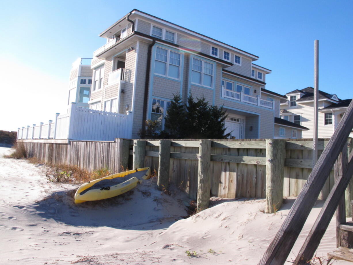 This Dec. 2 photo shows a wooden bulkhead in Margate N.J., which has been fighting a plan by New Jersey and the federal government to build protective sand dunes between the ocean and the bulkhead. A lawsuit from a group of homeowners says the dunes may cause ponds that could enable transmission of the Zika virus by mosquitoes.