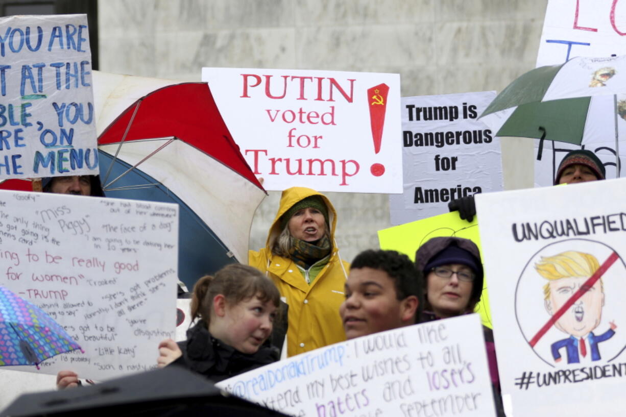 Protestors encourage electors to vote against Donald Trump and call for general electoral college reform outside the Oregon State Capitol in Salem, Ore., on Monday.