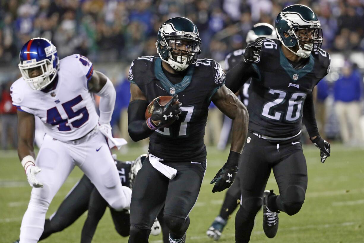 Philadelphia Eagles' Malcolm Jenkins (27) runs for a touchdown after intercepting a pass during the first half of an NFL football game against the New York Giants, Thursday, Dec. 22, 2016, in Philadelphia.