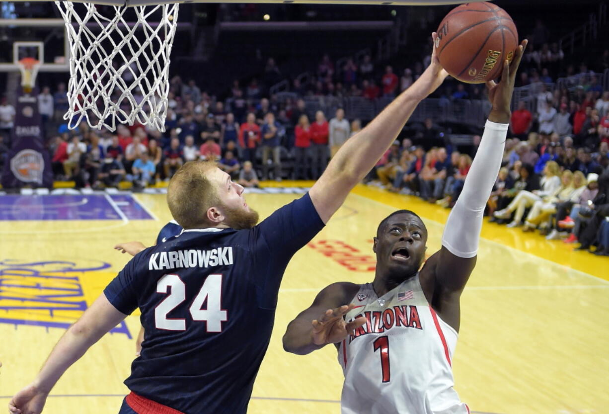 Arizona guard Rawle Alkins, right, shoots as Gonzaga center Przemek Karnowski defends during the second half. (Mark J.