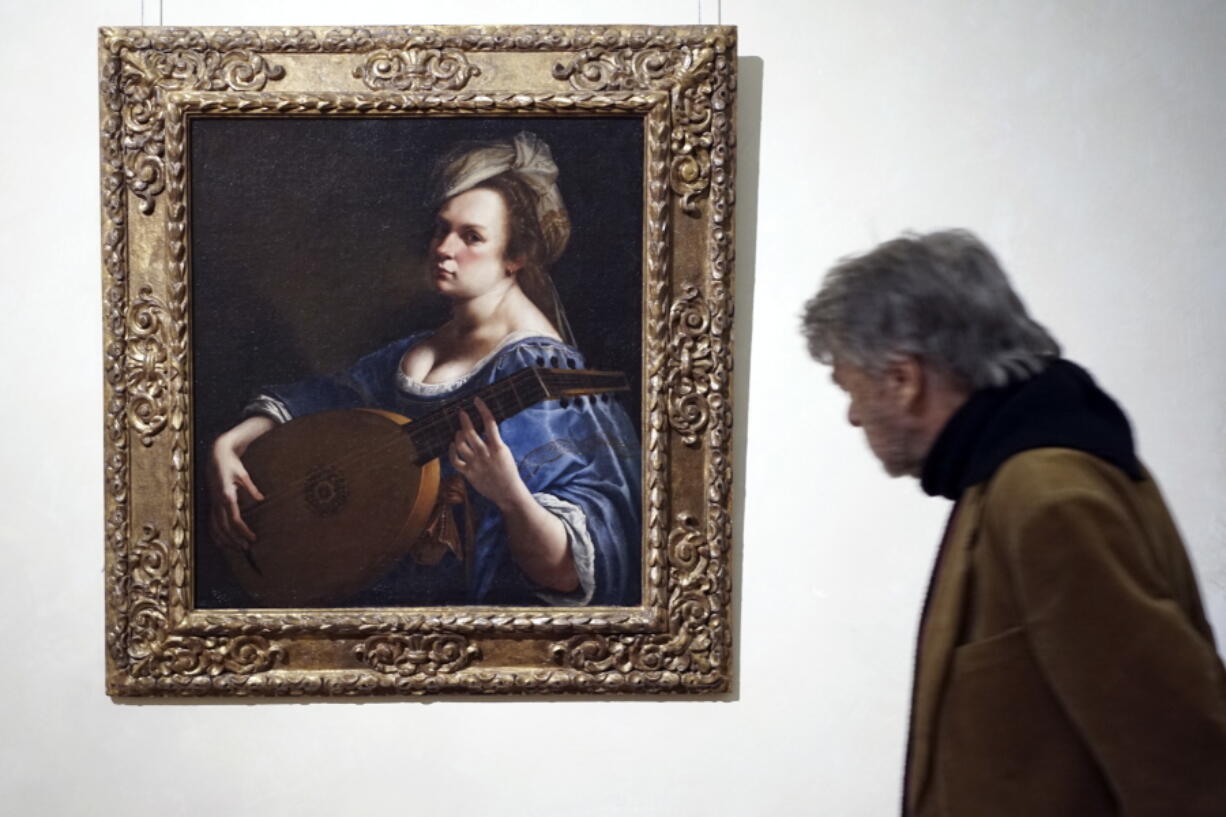 A visitor admires &quot;Self-Portrait as a Lute Player&quot; by 17th-century Italian artist Artemisia Gentileschi, on display at Rome&#039;s Braschi Palace museum, Tuesday. The Braschi museum is hosting the exhibition &quot;Artemisia Gentileschi and her Times&quot; from Nov. 30 to May 7.