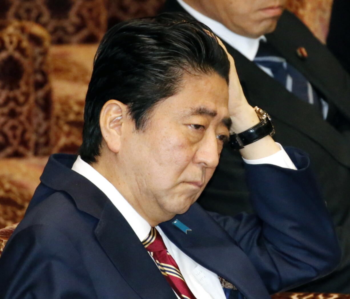 Japanese Prime Minister Shinzo Abe listens to questions during a special committee on the Trans-Pacific Partnership (TPP) at the parliament&#039;s upper house in Tokyo Friday, Dec. 9, 2016. Abe won parliamentary approval Friday for ratification of the TPP, despite U.S. President-elect Donald Trump&#039;s plan to withdraw from the 12-nation trade pact. Upper house lawmakers approved the TPP, heeding Abe&#039;s calls to push ahead with it despite Trump&#039;s rejection of the free-trade initiative championed by President Barack Obama.