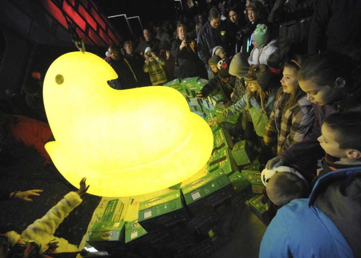 Children gather around a large Peep after it was dropped during the 2011 New Year&#039;s Eve celebration, at the Levitt Pavillion on the Steelstacks Campus in Bethlehem, Pa.