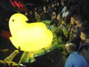 Children gather around a large Peep after it was dropped during the 2011 New Year&#039;s Eve celebration, at the Levitt Pavillion on the Steelstacks Campus in Bethlehem, Pa.